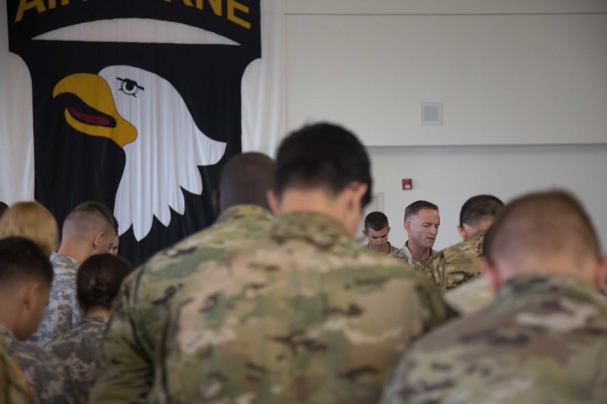 U.S. Army Chaplain Capt. Jeff Tilden (center), leads soldiers assigned to the 101st Combat Aviation Brigade in prayer prior to their flight to Puerto Rico, at Fort Campbell Airfield, Kentucky, on Sept. 26, 2017. (U.S. Army photo by Staff Sgt. Pablo N. Piedra)