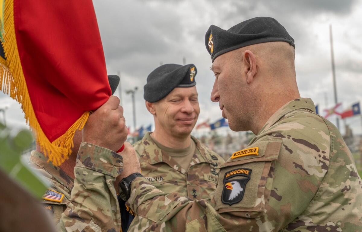 Maj. Gen David Gardner, right, incoming commanding general of the 101st Airborne Division and Fort Campbell, with Maj. Gen. Brett Sylvia, outgoing commanding general, during the change of command ceremony, May 30, 2025. (U.S. Army photo by Staff Sgt. Kaden D. Pitt)