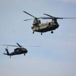A Black Hawk and a Chinook helicopter from Fort Campbell conduct a flyover on April 13, 2023. (Lee Erwin)