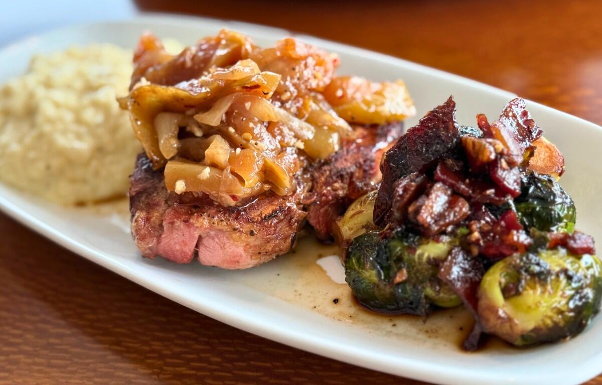 Bone-In Pork Chop at Trattoria di Cat in Shelby’s Trio. (Contributed)