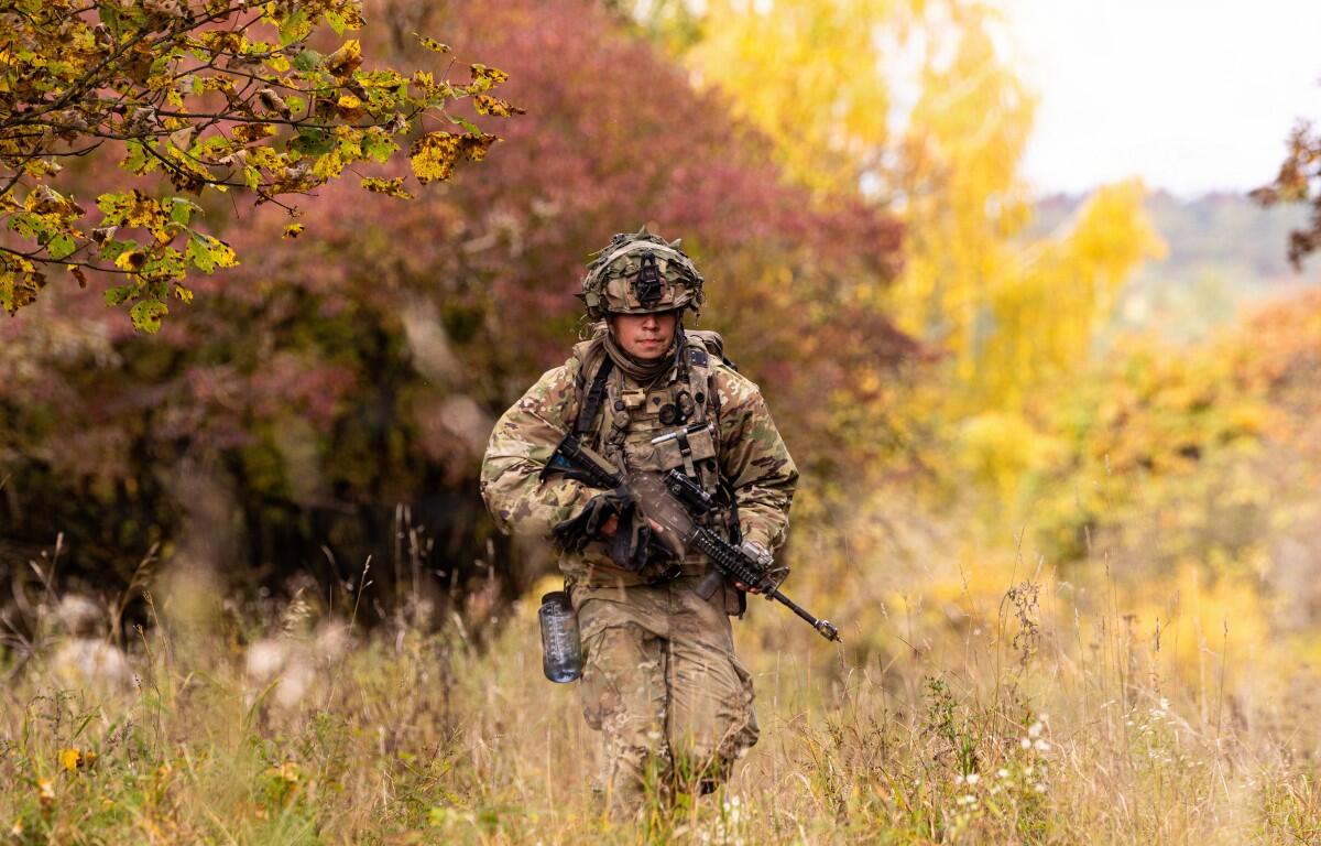 A U.S. soldier assigned to the 101st Airborne Division reacts to simulated contact during Combined Resolve 26-1 at the Hohenfels Training Area, Joint Multinational Training Center, Germany, Oct. 17, 2025. (U.S. Army photo by Sgt. Christian Aquino)