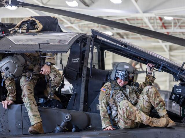 A 101st Combat Aviation Brigade pilot conducts egress testing from an AH-64 Apache helicopter while equipped with the Advanced Inflight Relief Universal System (AIRUS) at Fort Campbell, Oct. 5, 2026. (U.S. Army photo by Capt. Andrew Lightsey IV)