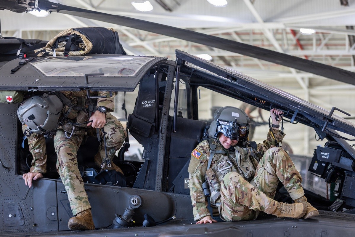 A 101st Combat Aviation Brigade pilot conducts egress testing from an AH-64 Apache helicopter while equipped with the Advanced Inflight Relief Universal System (AIRUS) at Fort Campbell, Oct. 5, 2026. (U.S. Army photo by Capt. Andrew Lightsey IV)